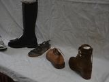 several pairs of shoes are lined up on a white table