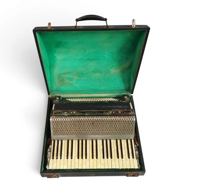 an open suitcase with a piano inside of it on a white surface