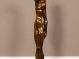 bronze statue of a man holding a baby on a black base
