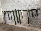 many tools hanging on a wall in a garage