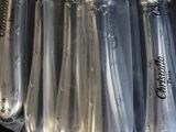 a bunch of knives that are wrapped in plastic bags