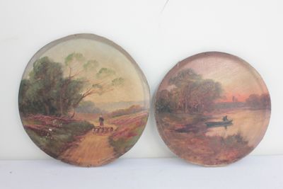 two plates with a painting of a man and a dog on a dirt road