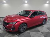 a red 2020 toyota avalon parked on a checkered tile floor