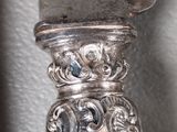 a close up of a silver object on a table