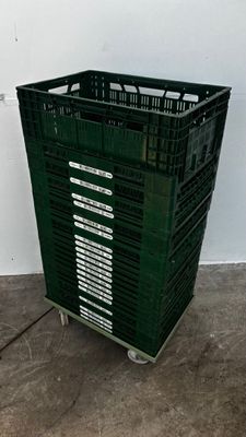 a green plastic crate sitting in a room