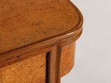 a close up of a wooden table with a drawer on it