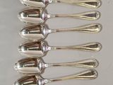 a lot of spoons that are sitting on a table