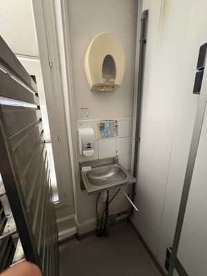 someone is taking a picture of a bathroom with a toilet and sink