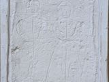 an image of a white wall with a small relief of a man and a woman