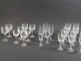 many empty wine glasses lined up on a table