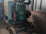 a small tractor that is sitting in a barn