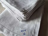 a lot of napkins that have been folded up on a bed