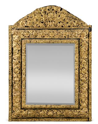 an ornately carved mirror with a gold frame on a white background