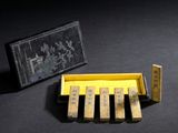 a small box that has a bunch of wooden pegs in it