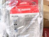 a bag of canon ink sitting on top of a pile of other items