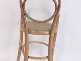 a wooden chair with a round back and seat