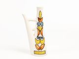 a white vase with an orange and yellow design on it
