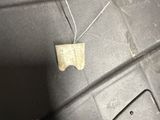 a small piece of paper on the side of a car