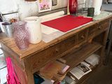 a wooden table with a red cloth on top of it