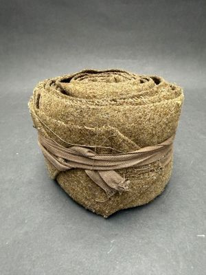 an image of a roll of brown rope wrapped around a brown object
