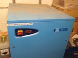 a blue machine that is sitting in a room
