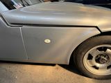 a close up of a car that has a denting on it