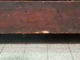 an old wooden box with a bunch of bananas in it