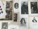 a lot of old photos of people on a table