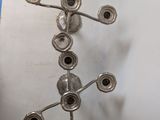 a metal object that is hanging on the wall