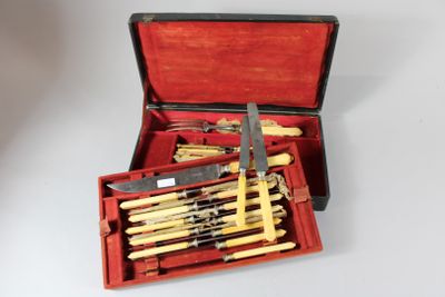 a red case with a set of knives in it