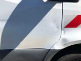 a white van with a red stripe on the side of it