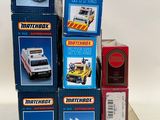 several boxes of matchbox cars are stacked on top of each other