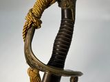 a close up of a sword with a rope on it