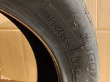 a close up of a tire on a wooden floor with a cardboard box in the background