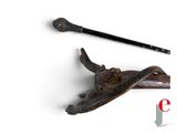 two old tools that are laying on a white surface