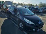 a black car that is parked in a parking lot