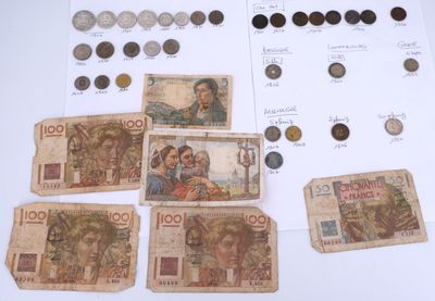 several different types of currency are displayed on a table
