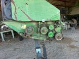 a large green machine that is sitting in a garage