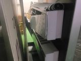 a microwave and a microwave oven on a shelf in a kitchen