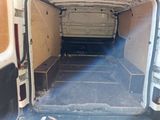 a white van that has been vandalized and is in the process of being repaired