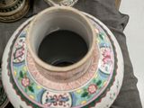 a vase that is sitting on a table next to other vases