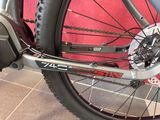 a close up of a bike with a chain on the front wheel