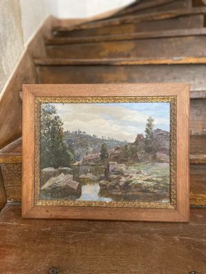 une photo d'une photo d'un tableau posé dans l'escalier