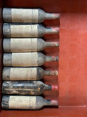six bottles of wine sitting in a red box