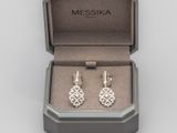 the earrings are in the box with the box open