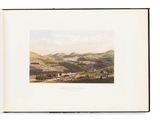 un livre sur lequel figure l'image d'une ville vue de loin
