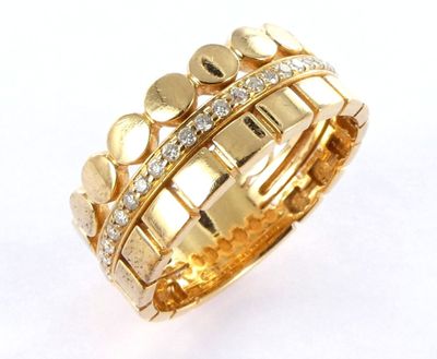 a close up of a gold ring with diamonds on it