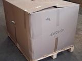 a large cardboard box sitting on a pallet in a warehouse