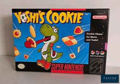 une boîte de biscuits Yoshi posée sur la table