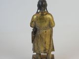 statue of a woman with a book in her hand